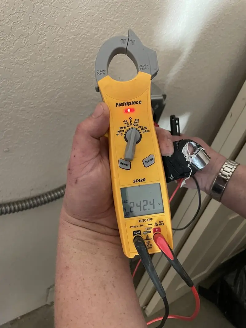 Voltage testing with clamp meter during Electrical Installation Services in Waupaca